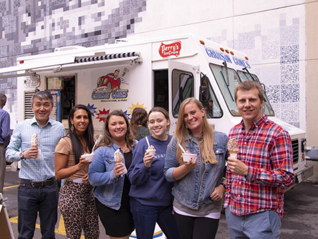 Impel team members getting ice cream from a truck.